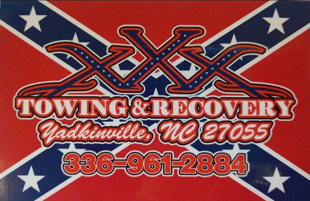 A red and white sign with the words " xxx swing & recovery ".