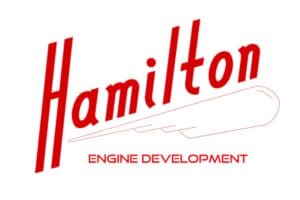 A red and white logo for hamilton engine development.