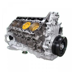 Silver car engine block with visible cylinders.